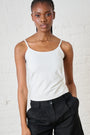 Model is wearing a milk colour cami with black pants by Me&B