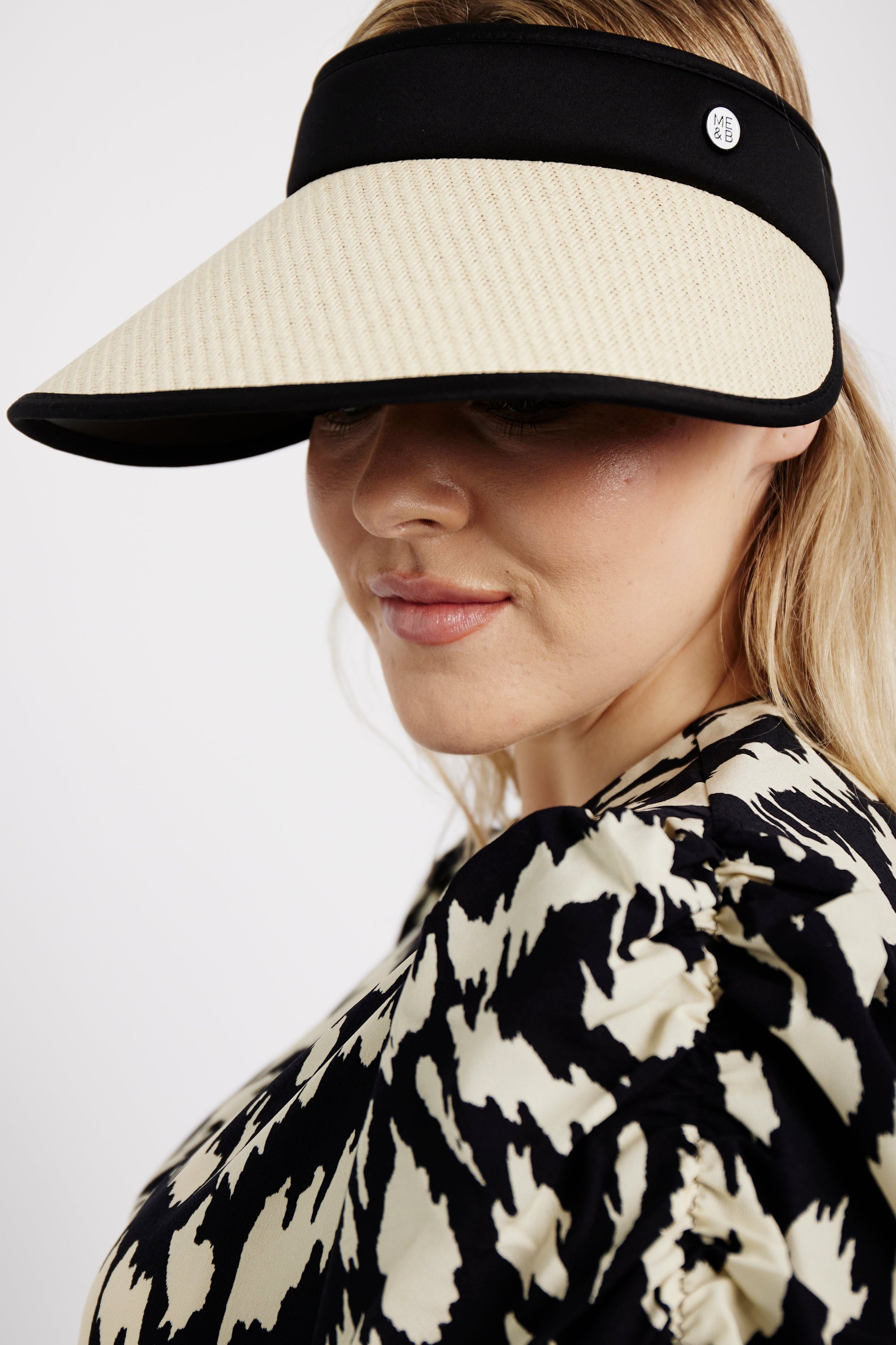 Model is wearing a natural straw visor by Me&B