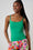Model is wearing a green cami top with floral shorts by Me&B