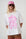 Model is wearing a white T-Shirt with Pink Print and a pink cap
