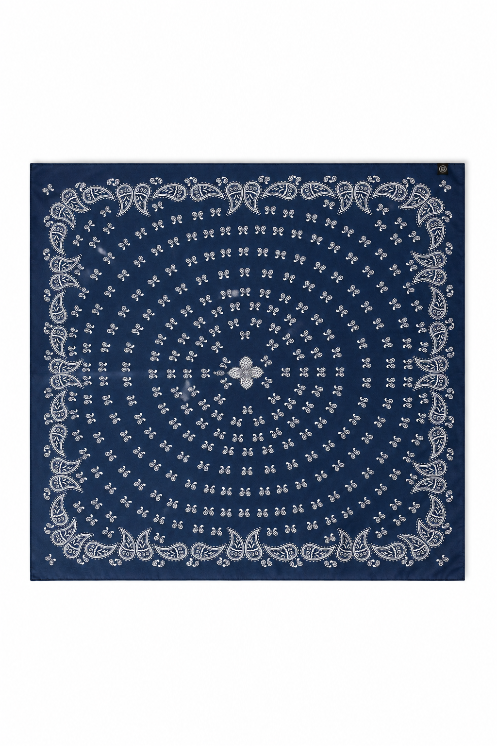 A square bandana featuring a classic indigo blue background with a white circular paisley and floral mandala pattern.