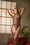 MODEL IS WEARING A CHOCOLATE BROWN SHAPEWEAR BODYSUIT