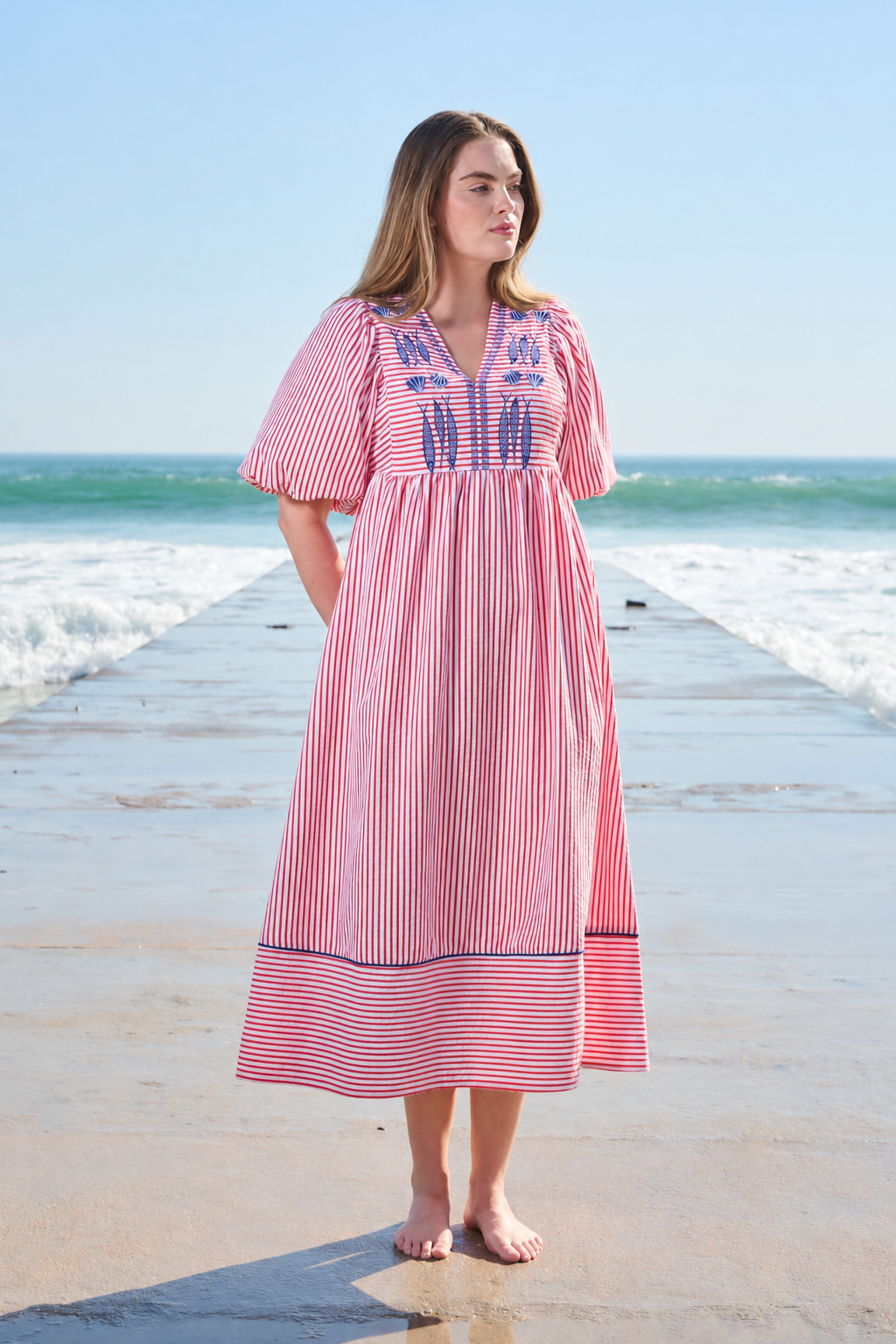 Red and white striped midi dress with blue embroidery and puff sleeves