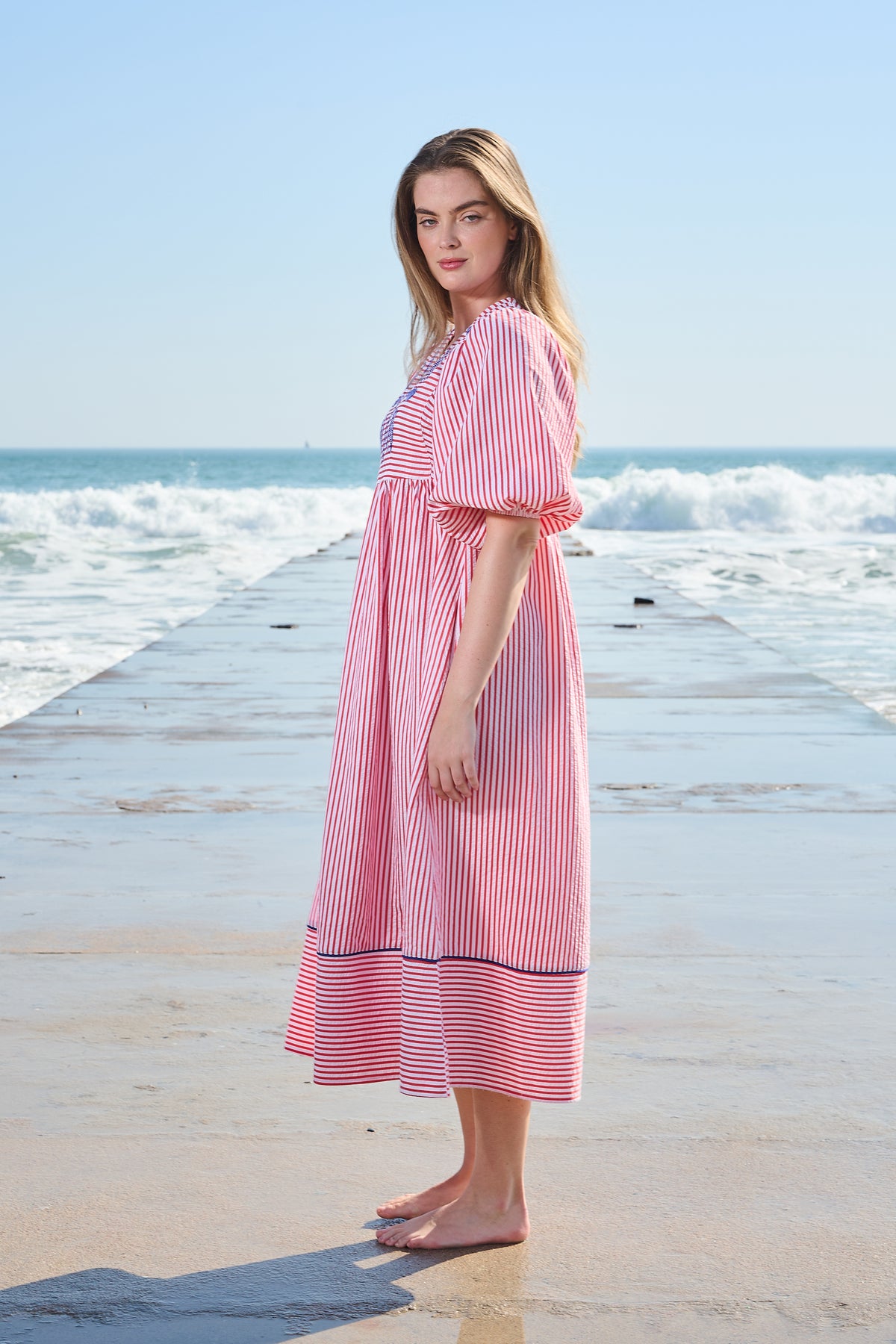 Red and white striped midi dress with blue embroidery and puff sleeves