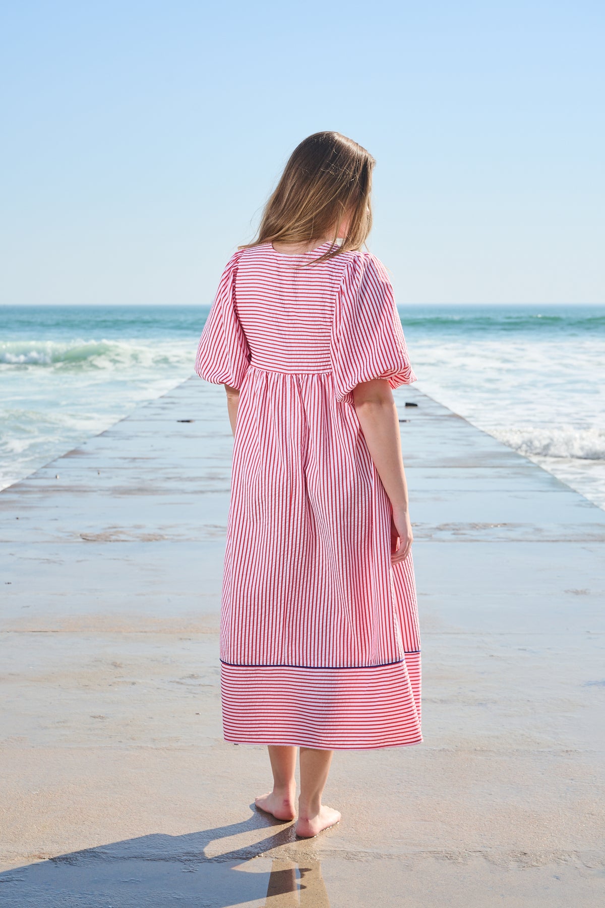 Red and white striped midi dress with blue embroidery and puff sleeves
