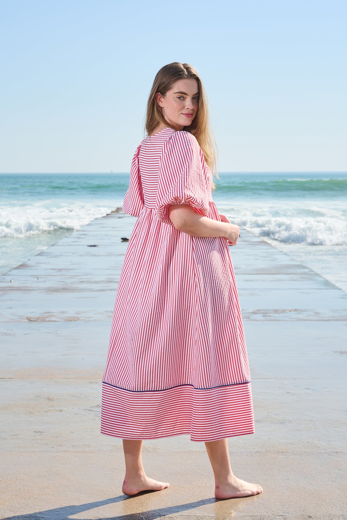 Red and white striped midi dress with blue embroidery and puff sleeves