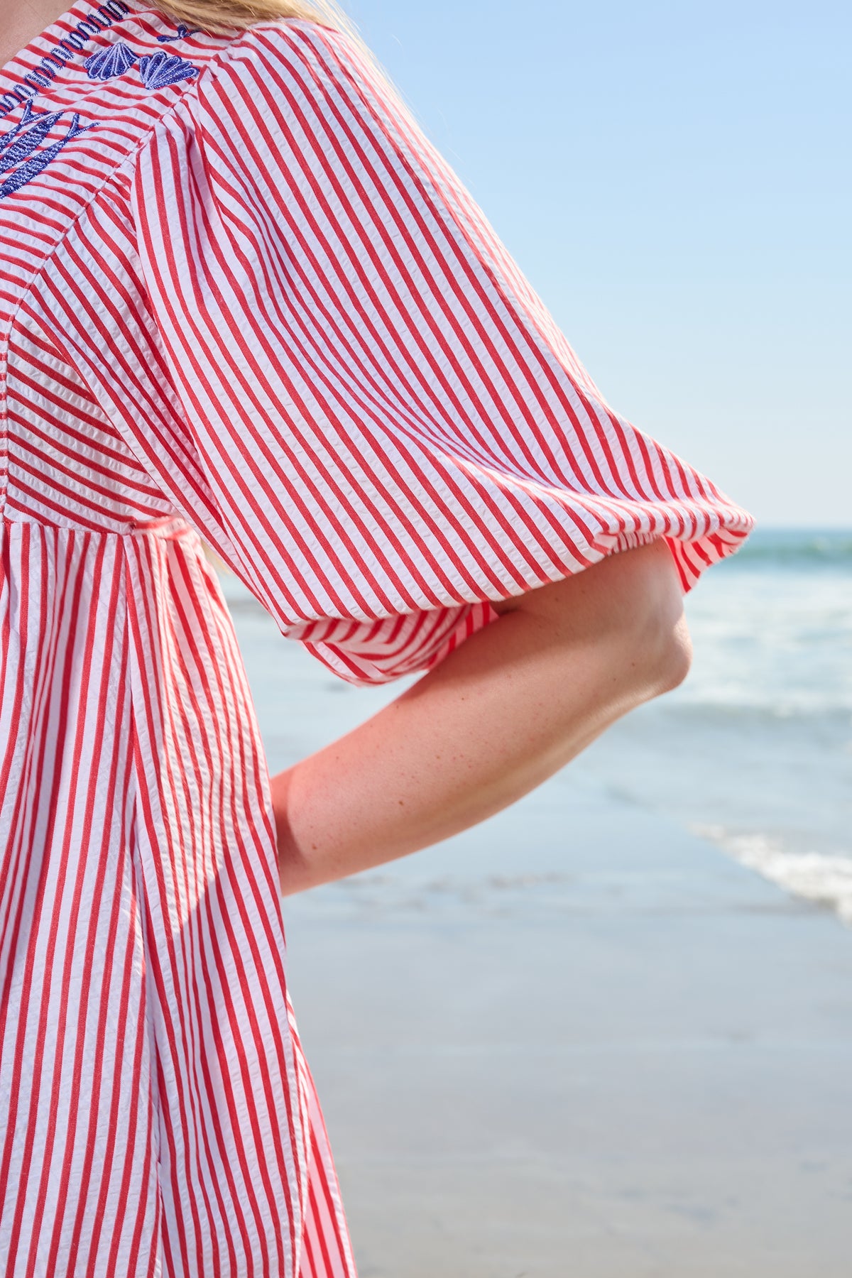 Red and white striped midi dress with blue embroidery and puff sleeves