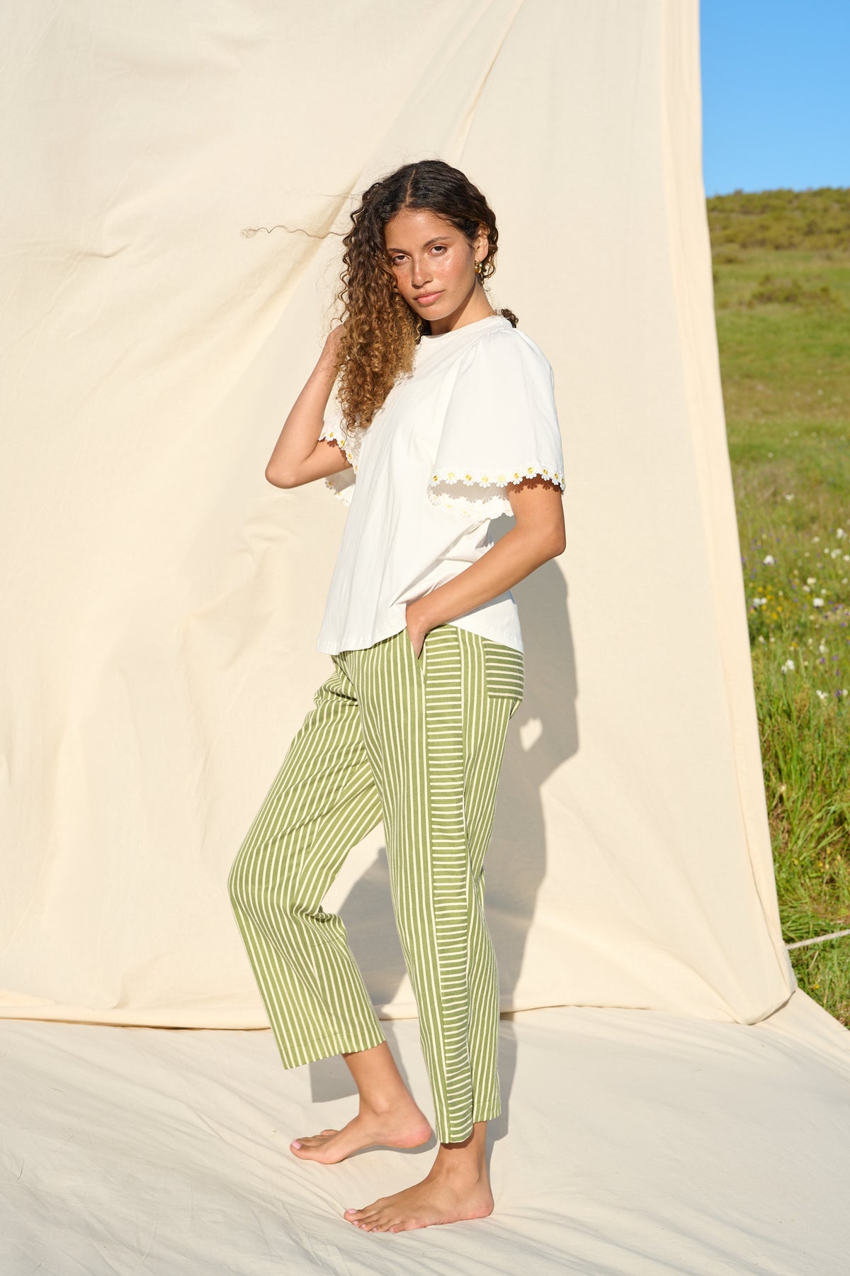 100% cotton white T-shirt with delicate yellow daisy trim sleeves
