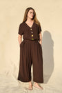 Model is wearing Dark chocolate rayon-linen wide-leg cropped trousers with front pleat