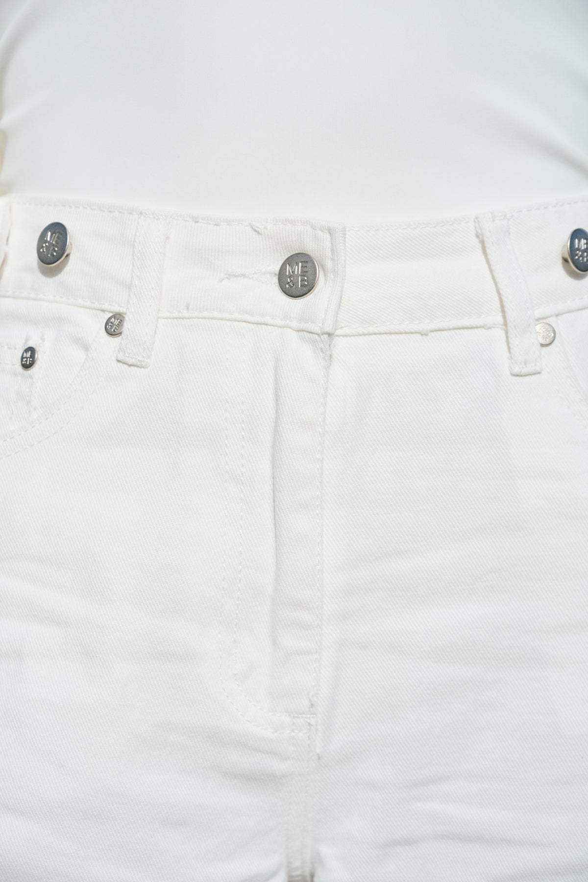 White cropped wide-leg jeans with broderie cutwork and scalloped hems