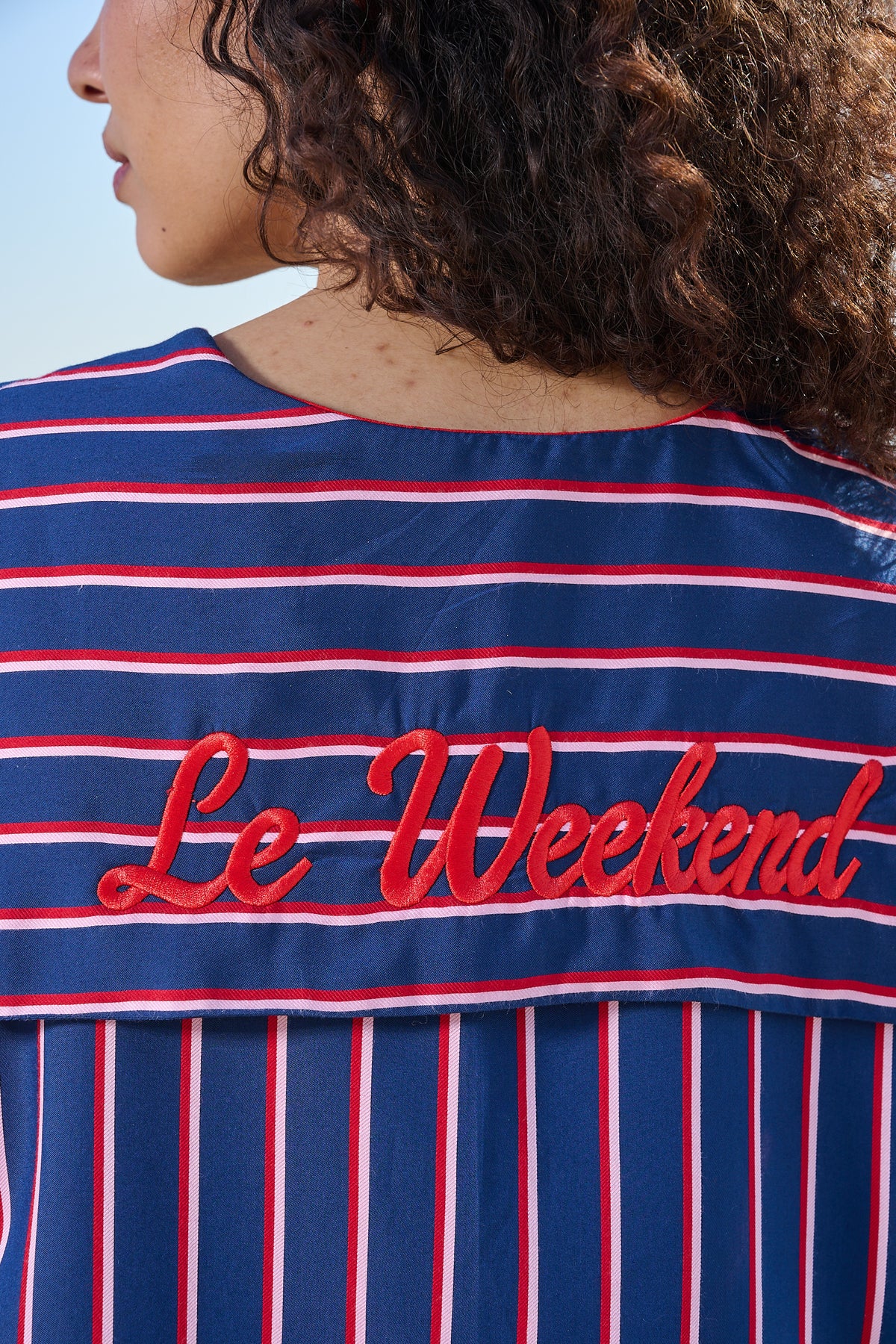 Extreme detail close up of 'Le Weekend' embroidery on the back of a sailor shirt collar
