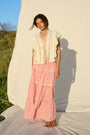 Pink gingham maxi skirt with lace trim and tiered ruffle detailing.