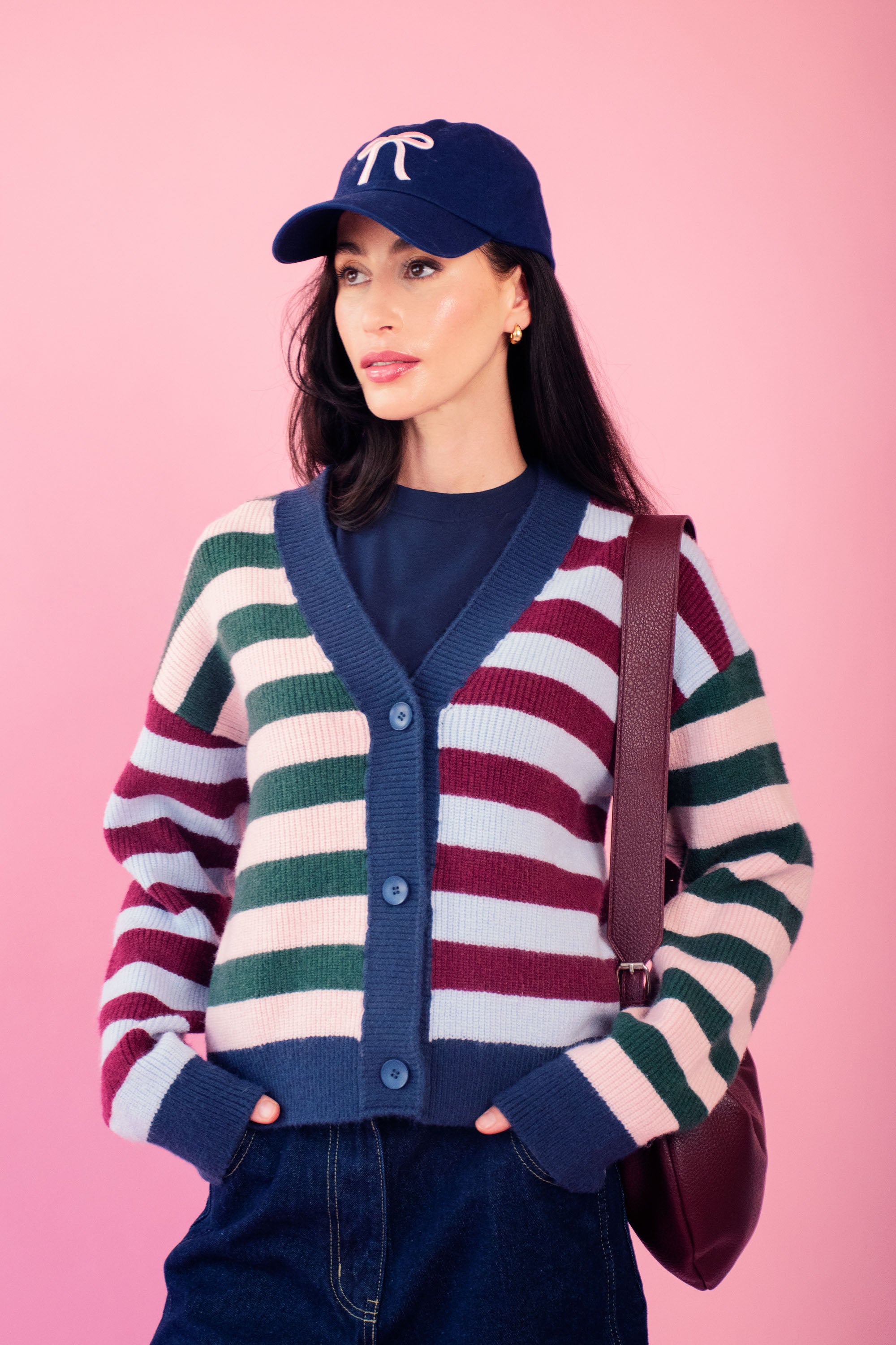 Model is wearing a multi striped mixed cardigan with jeans 