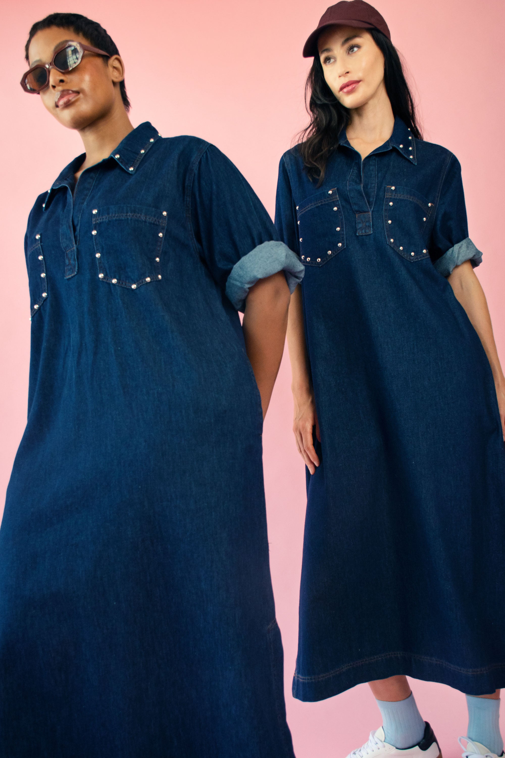 Models wearing dark denim midi length studded denim dress