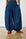 Model is wearing balloon jeans with red pumps 