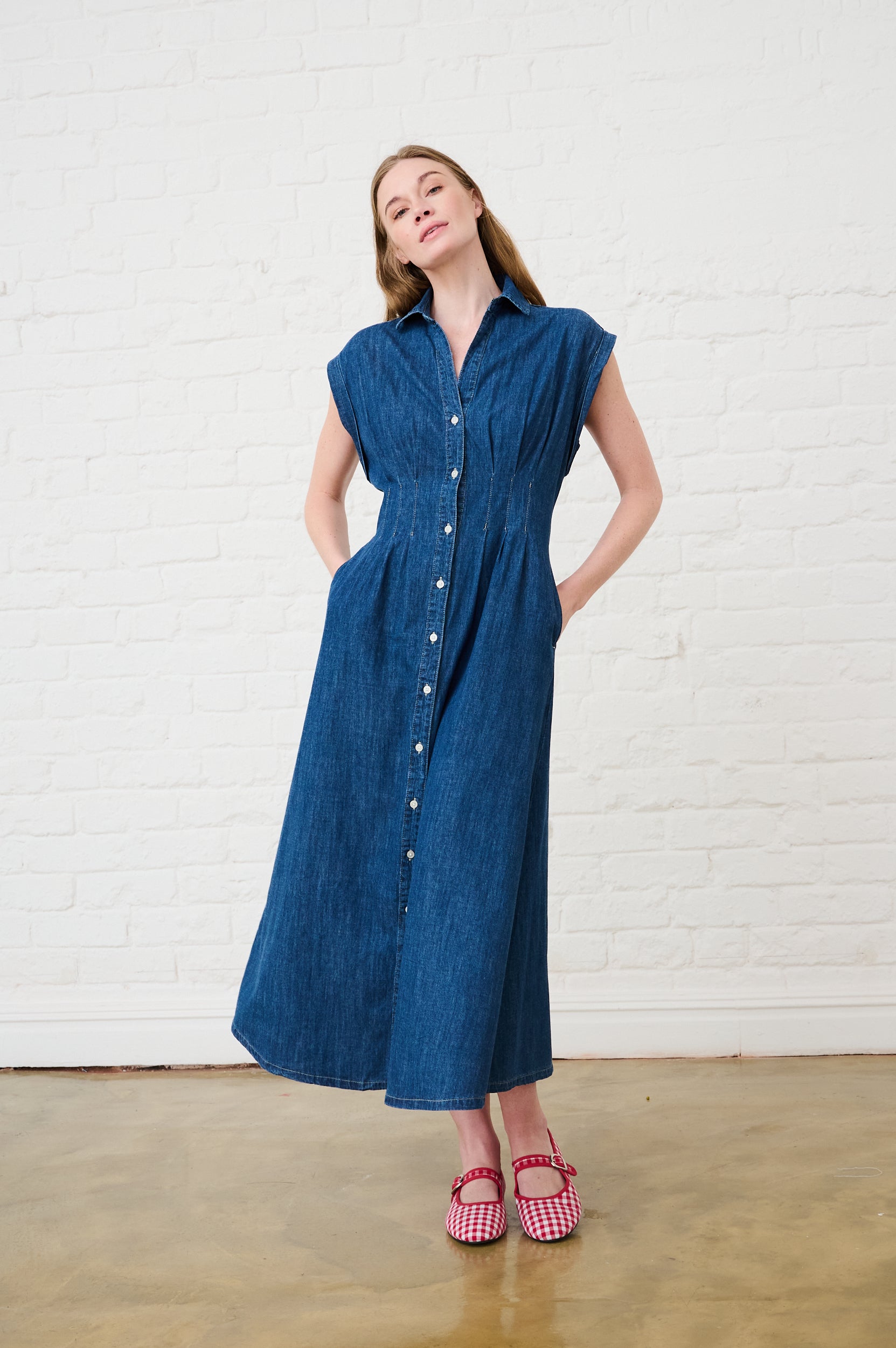 Model is wearing a denim dress