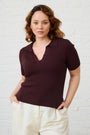 Model is wearing a brown knit top
