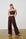 Model is wearing a linen brown crop top with brown linen wide leg pants and brown sandals by Me&B