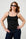 Model is wearing a black cami with black sunglasses by Me&B