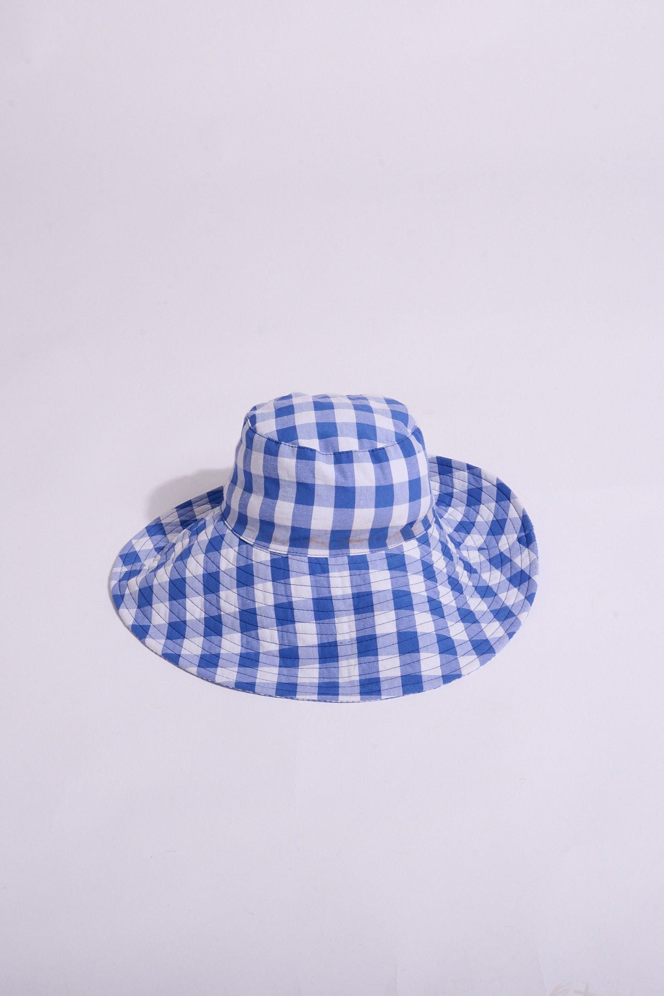 Blue and white checkered sun hat on a white background