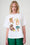 Woman wearing a white t-shirt with colorful graphic designs on a white background