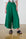 Model is wearing linen wide leg forrest green pants with black sandals