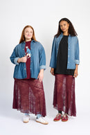 Models are wearing a burgundy lace skirt with denim jacket and sneakers