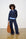 Model is wearing a navy quarter zip layered with a blue jumper and matching wide legs pants with leopard print sneakers 
