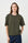 Model is wearing an olive green t shirt with dark wash denim jeans 
