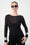 Model is wearing a black mesh long sleeve top with black jeans and silver accessories