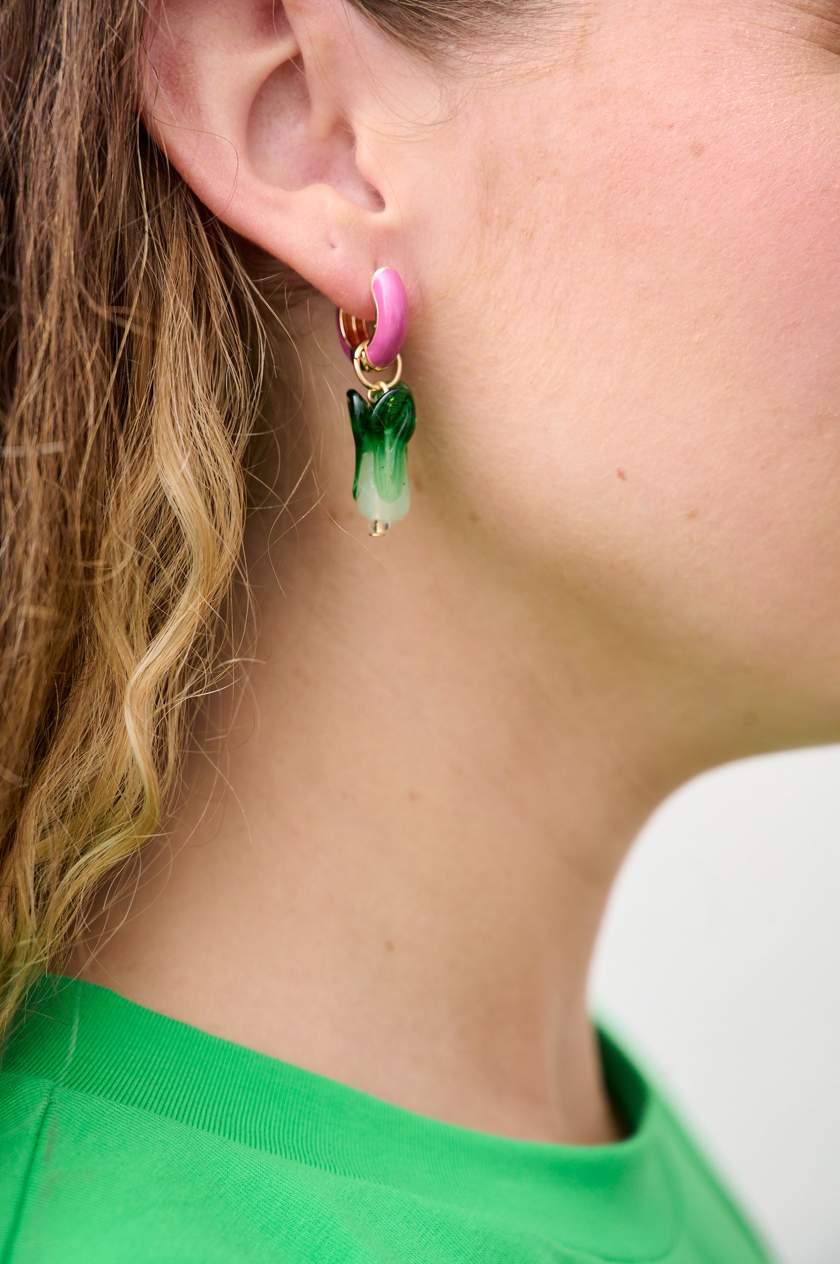 Model is wearing glass Bok Choi earrings