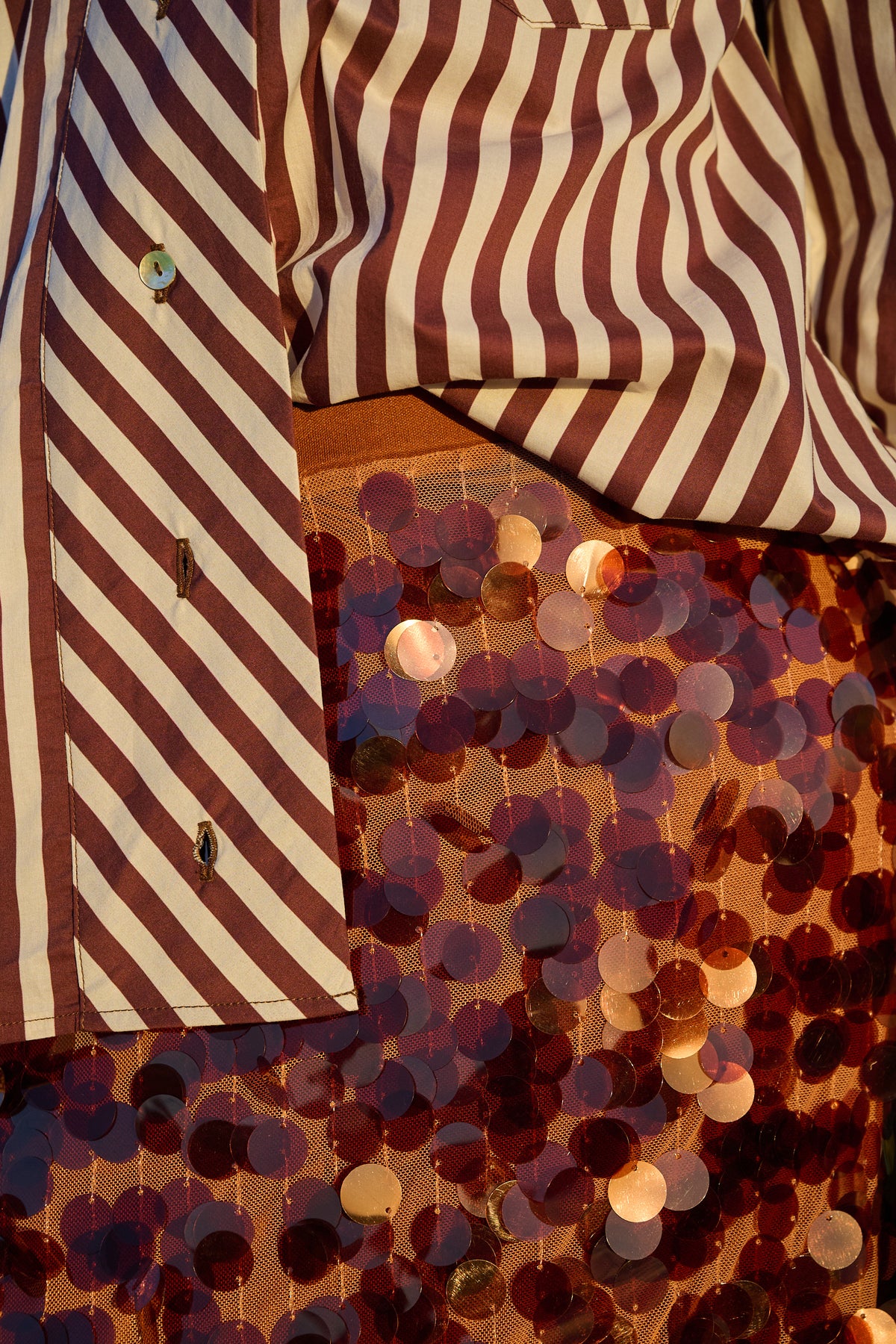 Close-up of chocolate sequin maxi skirt with oversized discs