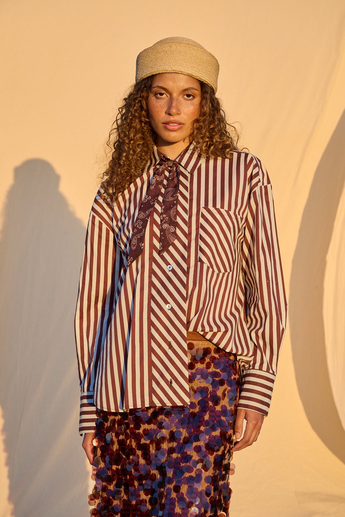 Model wearing chocolate and milk striped oversized button-up shirt