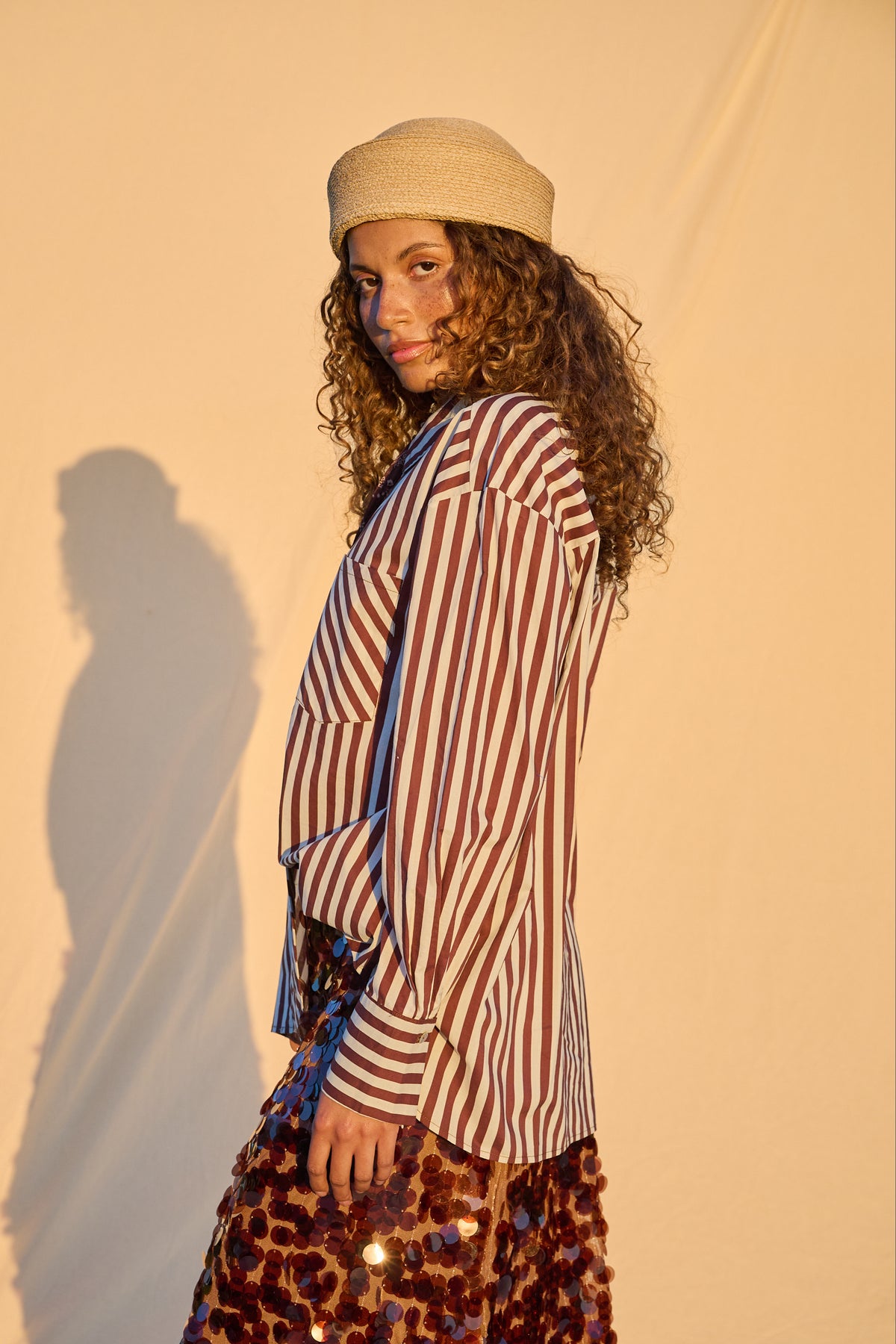 Model wearing chocolate and milk striped oversized button-up shirt
