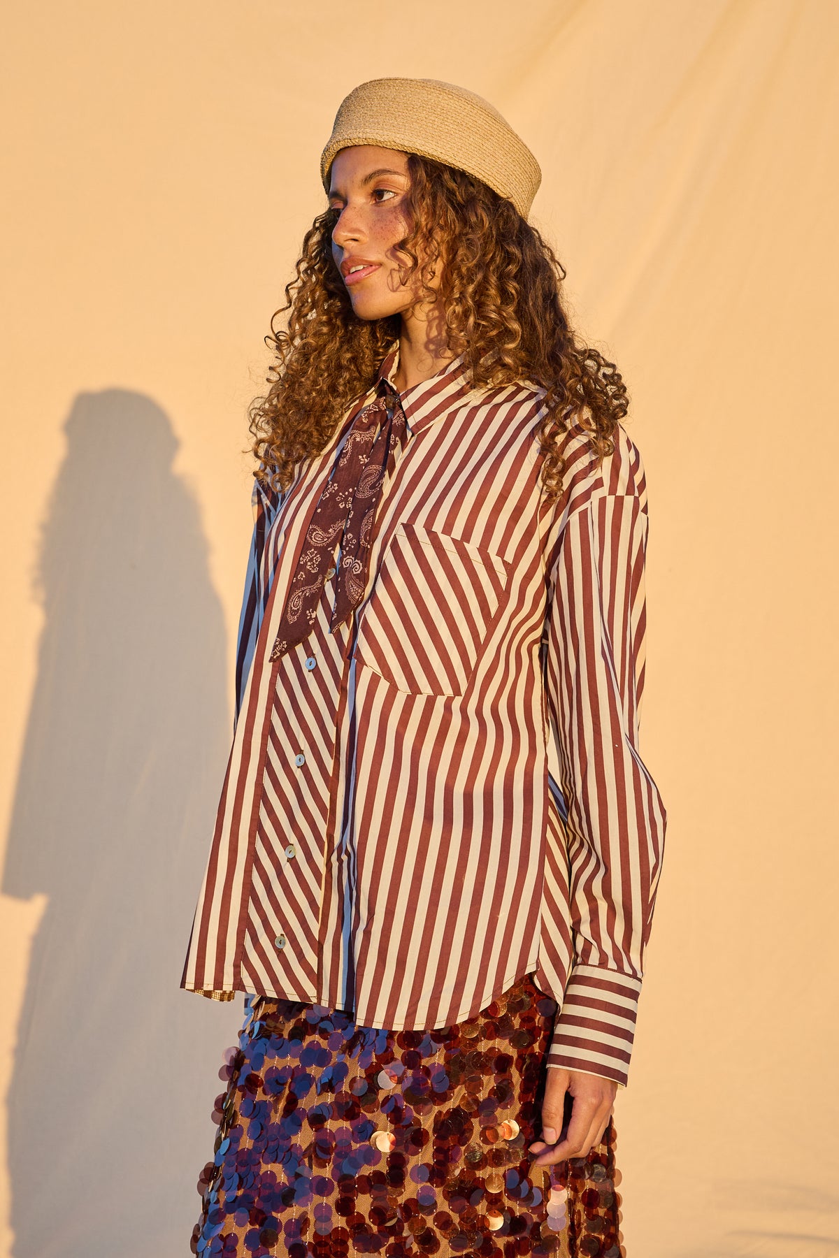 Model wearing chocolate and milk striped oversized button-up shirt
