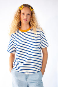 Model wearing a striped Tee with Egg embroidery 