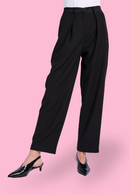 Model wearing tailored black pant with black heel
