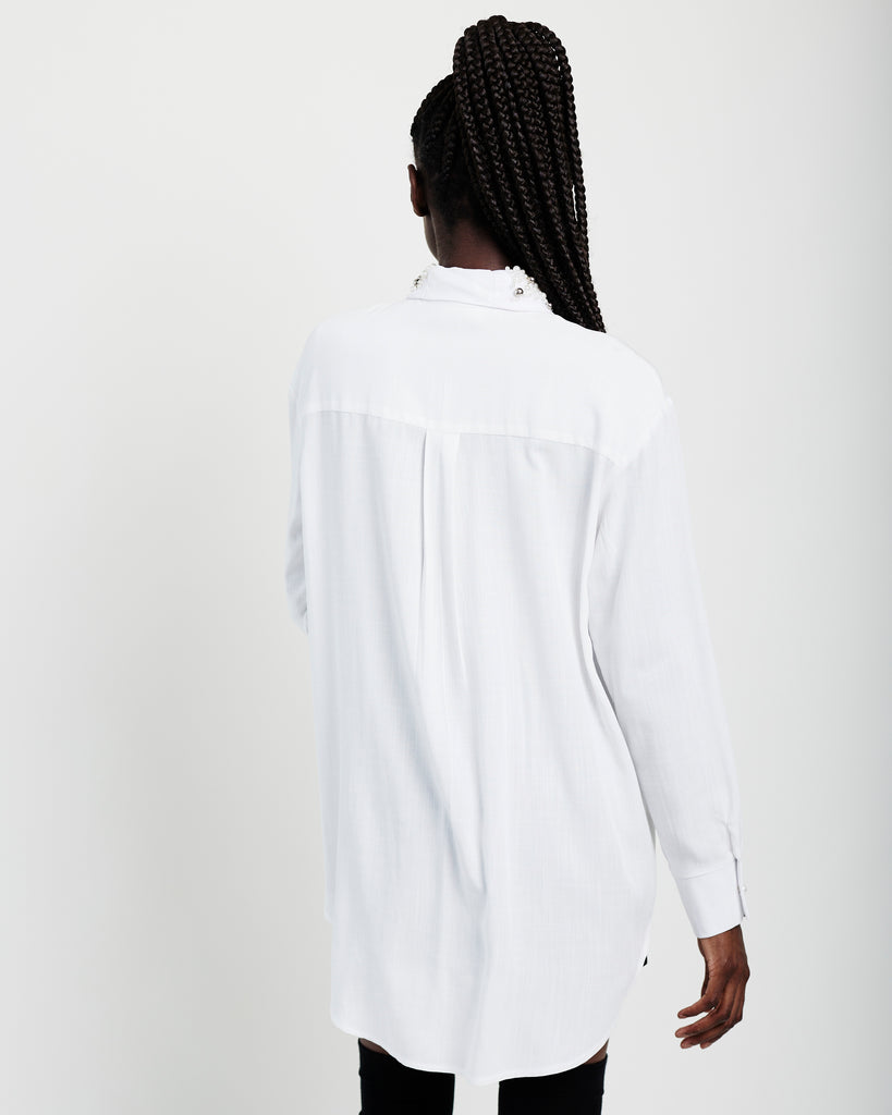 Me & B. Shirts. Women. White long sleeve shirt. White long sleeve button up. Embodied collar detail. Embodied collar long sleeve white button up. Local brands. South Africa.